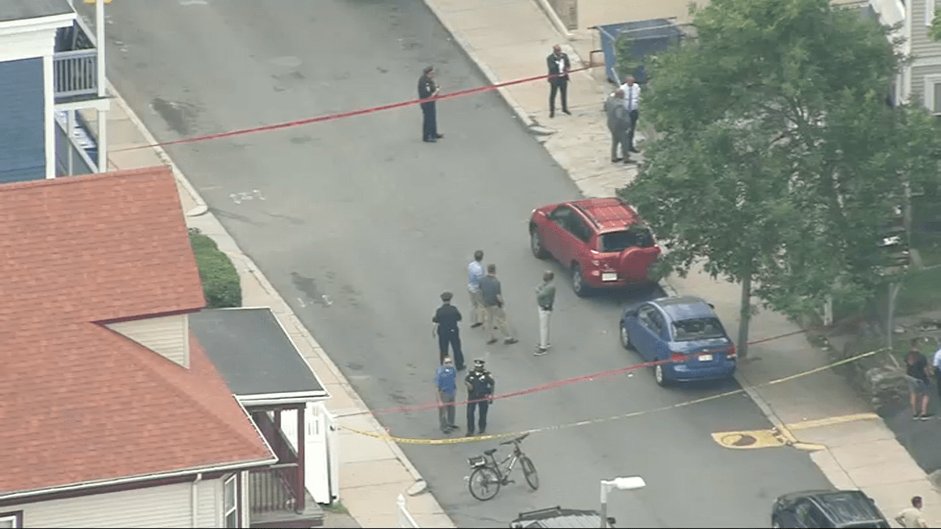 Investigators at the scene of a shooting in Boston's Mattapan neighborhood on Thursday, July 13, 2023.