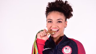 Laurie Hernandez Biting Gold Medal