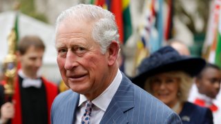 Britain's Prince Charles and Camilla the Duchess of Cornwall, in the background, leave after attending the annual Commonwealth Day service at Westminster Abbey in London, Monday, March 9, 2020. Prince Charles, the heir to the British throne, has tested positive for the new coronavirus.