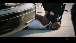 In this video grab issued Sunday, June 28, 2020, by BET, rapper DaBaby performs "Rockstar" as an actor playing a police officer presses his knee on DaBaby's neck, replicating the last few moments of George Floyd's life, during the BET Awards.