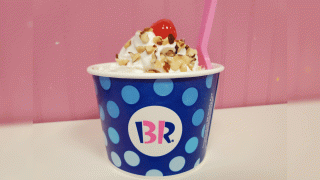 In this Jan. 16, 2020, file photo, Baskin Robbins ice cream sundae on white surface against pink background, with logo visible, in San Ramon, California.