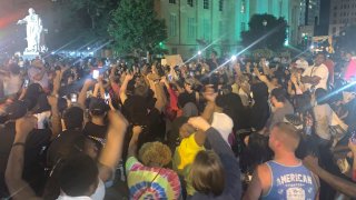 In a photo provided by Jada W., protesters gather Thursday, May 28, 2020, in downtown Louisville, Ky., after Breonna Taylor, a black woman, was fatally shot by police in her home in March. At least seven people were shot during the protest.