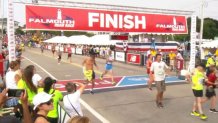 Falmouth Road Race 2019 people cross finish line