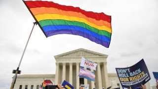 LGBTQ flag flies in front of the U.S. Supreme Court