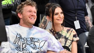 In this Jan. 13, 2020, file photo, Emily Ratajkowski and Sebastian Bear-McClard sit court side at a basketball game between the Los Angeles Lakers and the Cleveland Cavaliers at Staples Center in Los Angeles, California.