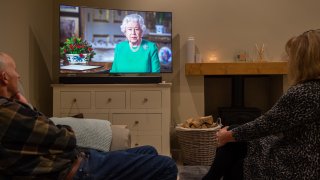 People in Leicester watch Queen Elizabeth II deliver her address to the nation and the Commonwealth in relation to the coronavirus epidemic.