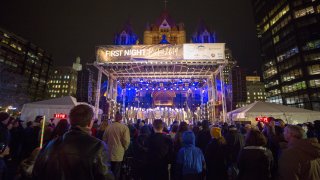A crowd watches a performance at First Night Boston 2019