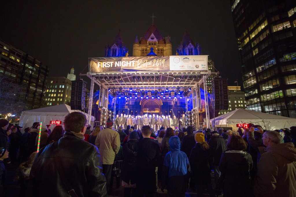 A crowd watches a performance at First Night Boston 2019