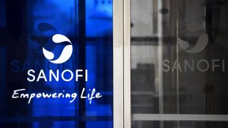 A photo taken on March 27, 2020, shows the Sanofi logo at the company headquarters in Paris.