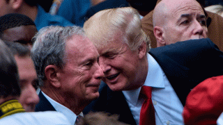 Then-presidential nominee Donald Trump speaks to former New York City Mayor Michael Bloomberg during a memorial service at the National 9/11 Memorial on Sept. 11, 2016, in New York.