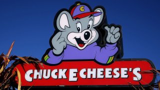 A sign is posted in front of a Chuck E. Cheese restaurant on January 16, 2014 in Newark, California.