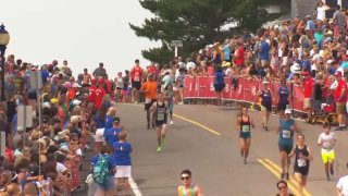 falmouth road race 2019 runners thru crowds