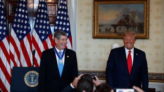 Olympian and former U.S. Rep. Jim Ryun stands with President Donald Trump, who presented him with the Presidential Medal of Freedom, in the Blue Room of the White House, July 24, 2020, in Washington.