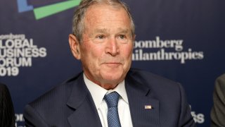 Former U.S. President George W. Bush listens to speaking during the Bloomberg Global Business Forum in New York