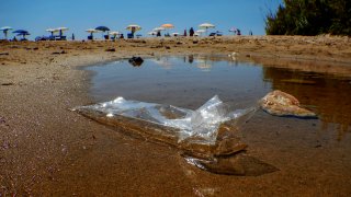 Plastic waste abandoned on the beach of the sea in Gaeta, Lazio region.