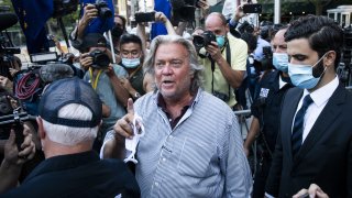 In this Aug. 20, 2020, file photo, Steve Bannon, former U.S. President Donald Trump political strategist, center, departs from federal court in New York.