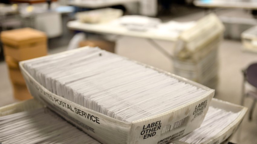 Stacks of mail-in ballots.