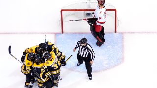 Bruins celebrate goal against Hurricanes