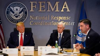 WASHINGTON, DC - MARCH 19: President Donald Trump, left, and Vice President Mike Pence listen as Acting Secretary of Homeland Security Chad Wolf  speaks during a teleconference with governors at the Federal Emergency Management Agency headquarters on March 19, 2020 in Washington, DC. With Americans testing positive from coronavirus rising President Trump is asking Congress for $1 trillion aid package to deal with the COVID-19 pandemic.