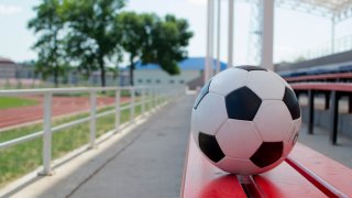 football at the stadium in summer weather