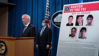 Deputy Attorney General Jeffery Rosen speaks, Sept. 16, 2020, at the Justice Department in Washington. The Justice Department has charged five Chinese citizens with hacks targeting more than 100 companies and institutions in the United States and abroad, including social media and video game companies as well as universities and telecommunications providers.