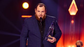 In this Nov. 11, 2020, file photo, Luke Combs accepts an award onstage during the 54th Annual CMA Awards at Nashville’s Music City Center in Nashville, Tennessee.