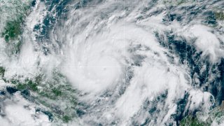 This GeoColor satellite image taken Monday, Nov. 2, 2020, at 1 p.m. EDT, and provided by NOAA, shows Hurricane Eta in the Gulf of Mexico approaching the border of Honduras and Nicaragua. New Hurricane Eta quickly gained force Monday as it headed for Central America on the verge of becoming a major hurricane, threatening massive flooding and landslides across a vulnerable region.