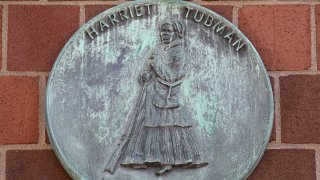 A plaque is seen on the exterior of the Harriet Tubman House on September 19, 2019 in Boston, Massachusetts.