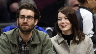 Emma Stone and Dave McCary attend the Golden State Warriors and Los Angeles Clippers basketball game at Staples Center on January 18, 2019 in Los Angeles, California.