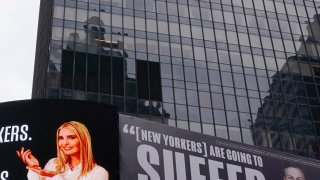 A billboard by The Lincoln Project is seen in Times Square on Oct. 25, 2020, in New York, depicting Ivanka Trump presenting the number of New Yorkers and Americans who have died due to Covid-19 along with her husband Senior Advisor to the President Jared Kushner, with a Vanity Fair quote.
