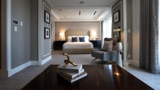 This file photo shows the master bedroom inside a Boston Harbor Hotel suite.