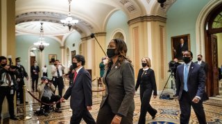 The impeachment managers Representatives Ted Lieu (D-CA), Stacey Plaskett (D-US Virgin Islands AT-Large), Joe Neguse (D-CO), and Madeleine Dean (D-PA) leave the Senate floor after delivering the article of impeachment on Capitol Hill on January 25, 2021 in Washington DC.