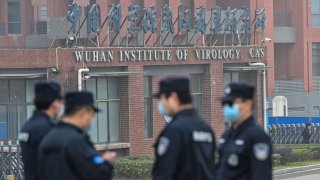 security personnel stand guard outside the Wuhan Institute of Virology in Wuhan