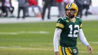 Aaron Rodgers #12 of the Green Bay Packers walks across the field in the second quarter against the Tampa Bay Buccaneers during the NFC Championship game at Lambeau Field on January 24, 2021 in Green Bay, Wisconsin.
