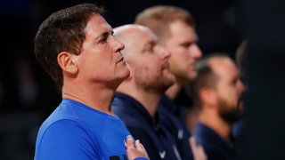 In this Oct. 12, 2017, file photo, Mark Cuban, owner of the Dallas Mavericks, stands during the National Anthem prior to the game against the Atlanta Hawks at McCamish Pavilion in Atlanta, Georgia.
