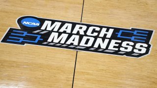 A 'March Madness' logo on a basketball court