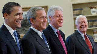 Former Presidents Barack Obama, George W. Bush, Bill Clinton and Jimmy Carter seen in the Oval Office at the White House in Washington, D.C., Jan. 7, 2009. The former Presidents of the United States have come together to promote vaccinations in two national ad campaigns.