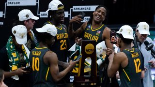 Baylor players celebrate with the trophy at the end of the championship game against Gonzaga in the men's Final Four NCAA college basketball tournament, Monday, April 5, 2021, at Lucas Oil Stadium in Indianapolis. Baylor won 86-70.