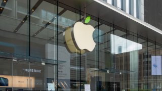 In this April 22, 2021, file photo, the Apple logo lights up its "green leaves" outside the Apple Store on Nanjing Road in response to the 52nd Earth Day in Shanghai.