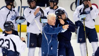 Red Gendron, coach of the UMaine men's hockey team, instructs his players in 2015