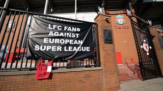 A banner is seen outside Liverpool's Anfield Stadium protesting the formation of the European Super League, Liverpool, England, Monday, April 19, 2021. Players at the 12 clubs setting up their own Super League could be banned from this year's European Championship and next year's World Cup, UEFA President Aleksander Ceferin said Monday.
