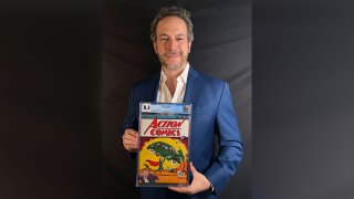 This photo provided by Metropolis Collectibles on Tuesday, April 6, 2021, shows Vincent Zurzolo, co-owner of ComicConnect, holding Action Comics first edition 1938 comic book marking Superman's first appearance, which has sold for an historic, record-breaking $3,250,000.