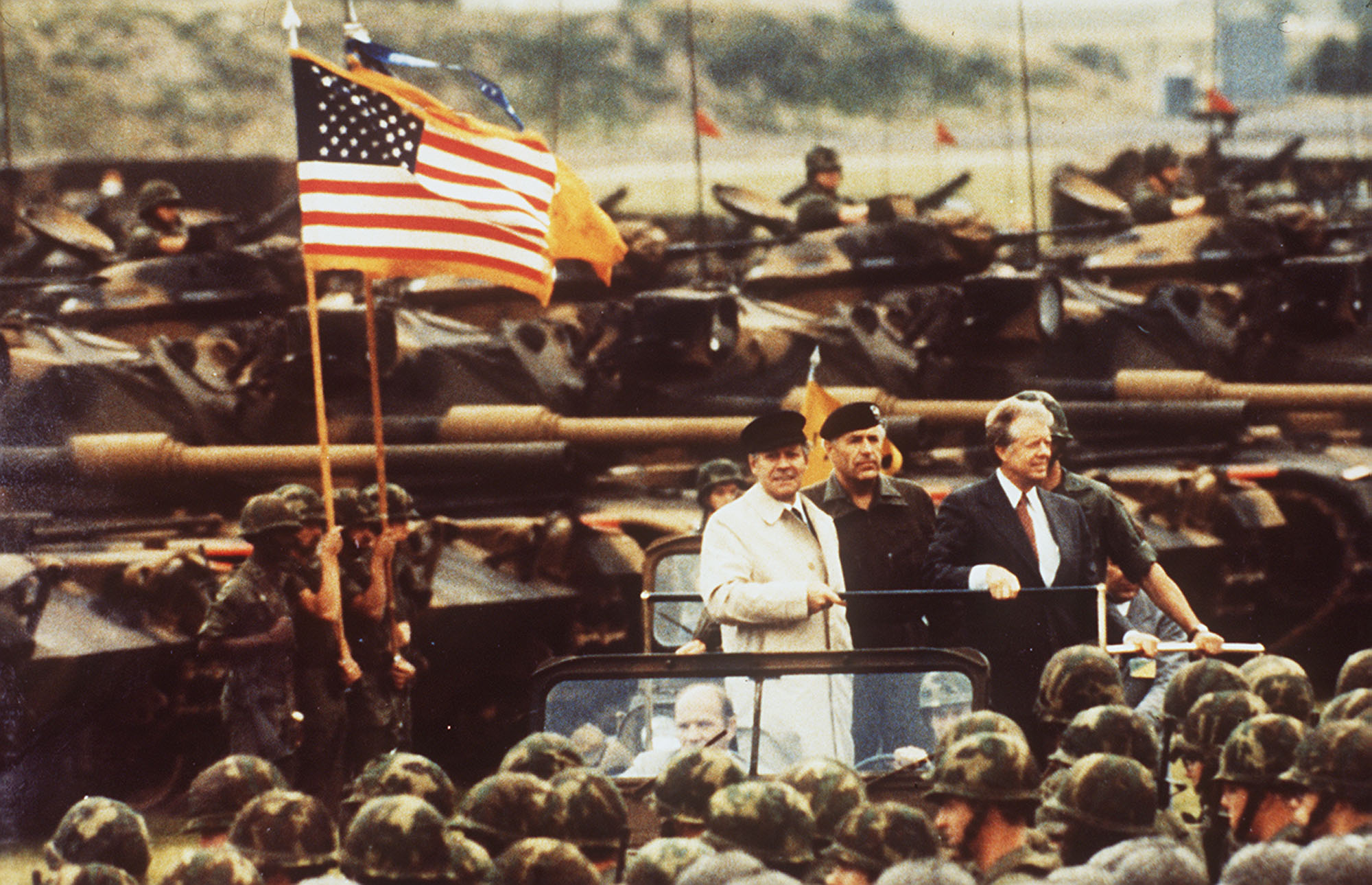 President Jimmy Carter rides with Chancellor Helmut Schmidt on a visit to West Germany in 1978 during a review of United States Forces at a base near Frankfurt.