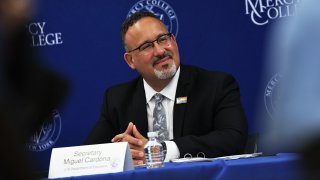 U.S. Secretary of Education Miguel Cardona listens to a speaker during a roundtable discussion at Mercy College on June 14, 2021 in the Pelham Bay neighborhood of the Bronx borough in New York City.