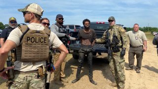 Tyler Terry, a suspect wanted in the killings of multiple people, is arrested in rural Chester County, S.C., on May 24 after a weeklong manhunt ended without a shot fired as hundreds of officers surrounded him.