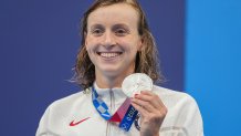 Katie Ledecky, of the United States poses with her silver medal in the women's 400-meters freestyle at the 2020 Olympics on July 26, 2021, in Tokyo, Japan.