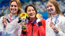 Gold medalist Yui Ohashi, centre, of Japan, stands with silver medalist Alex Walsh of the United States and bronze medalist Kate Douglass, right, of the United States, right, after the women's 200-meter individual medley final at the 2020 Summer Olympics, Wednesday, July 28, 2021, in Tokyo, Japan.