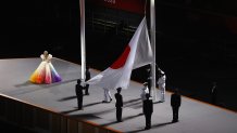 Misia sings the Japanese national anthem as the Japanese flag is hoisted during the Opening Ceremony of the Tokyo 2020 Olympic Games at Olympic Stadium on July 23, 2021 in Tokyo, Japan.