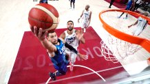 Zach LaVine #5 of Team United States drives past Rudy Gobert #27 of Team France for a layup during the second half of the Men's Preliminary Round Group B game on day two of the Tokyo 2020 Olympic Games at Saitama Super Arena on July 25, 2021 in Saitama, Japan.