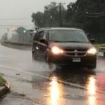 Car driving in East Hartford during Tropical storm Elsa